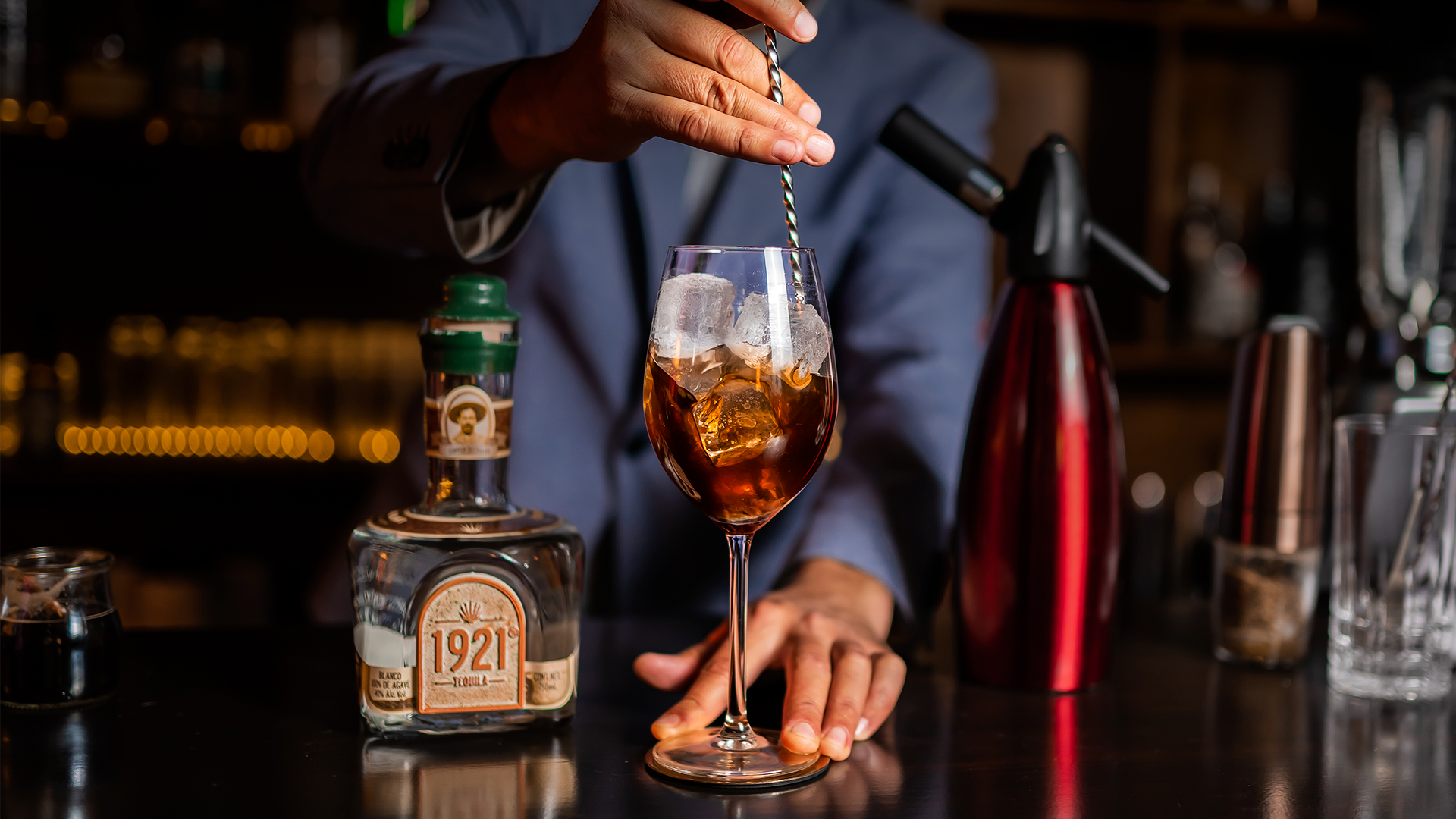 Adding 1921 Tequila Blanco and agave syrup